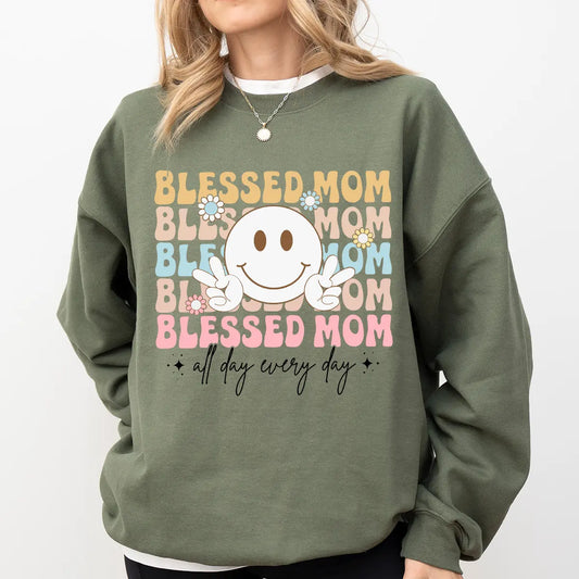 DTF Transfers ready to press – Blessed Mom pastel design with peace sign smiley and floral details on a green sweatshirt.