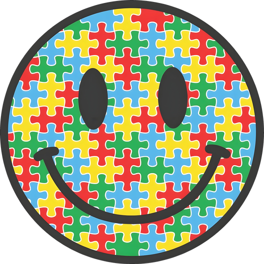 Smiley face filled with red, yellow, green, and blue puzzle pieces – autism awareness DTF transfer with bold black outline.