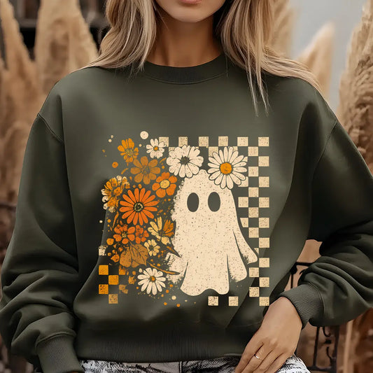Green sweatshirt with DTF transfer design featuring a cute ghost, vintage orange and cream flowers, and distressed checkered background.
