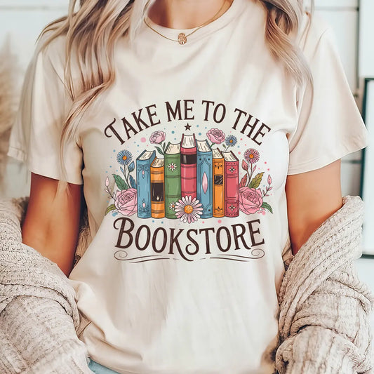 Natural color t-shirt with “Take Me to the Bookstore” DTF transfer design featuring floral-decorated vintage books—perfect for readers and book lovers.