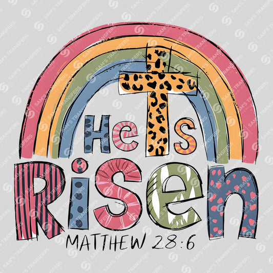Apparel featuring a He Is Risen Rainbow-themed DTF transfer.