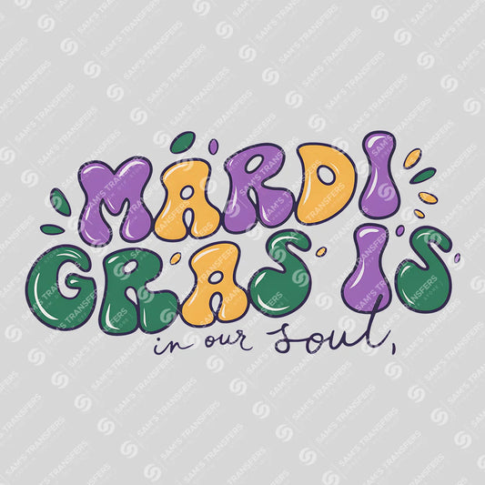 Apparel featuring a Mardi Gras Is In Our Soul-themed DTF transfer.