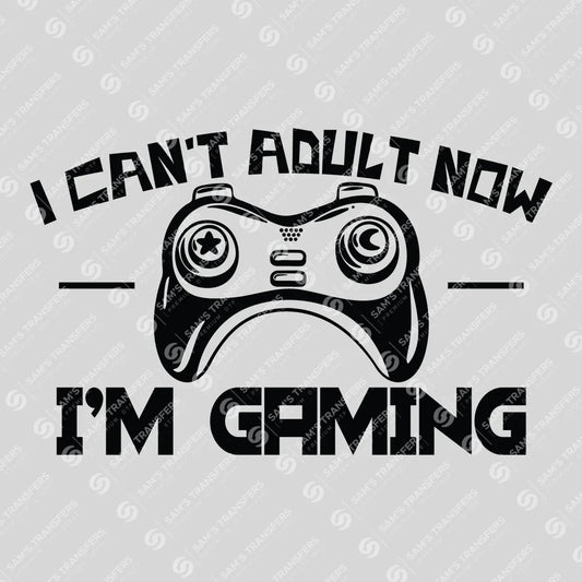 Apparel featuring a I Can't Adult Now I'm Gaming-themed DTF transfer.