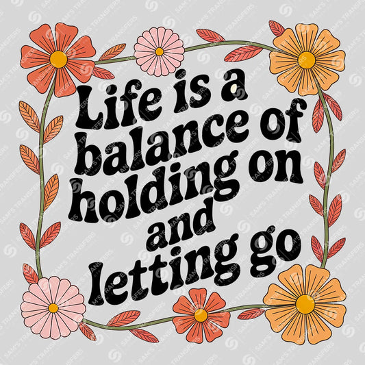Apparel featuring a Life Is A Balance Of Holding On And Letting Go-themed DTF transfer.