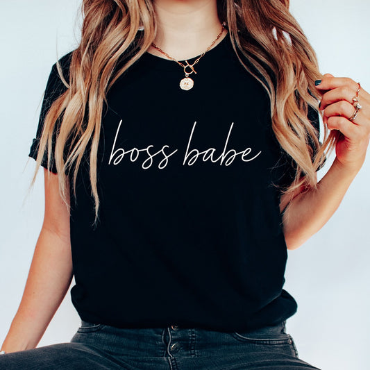 Black t-shirt with white handwritten “boss babe” DTF transfer design, perfect for minimalist and entrepreneur-themed apparel.