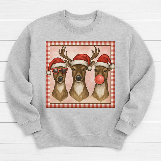 Three reindeers with Santa hats on a red and white checkered background printed on a Christmas sweatshirt