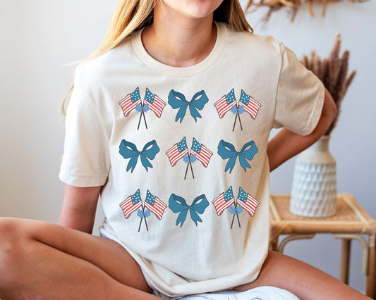 "Patriotic Flags and Bows" DTF Transfer with American flags and blue bows for 4th of July shirts.