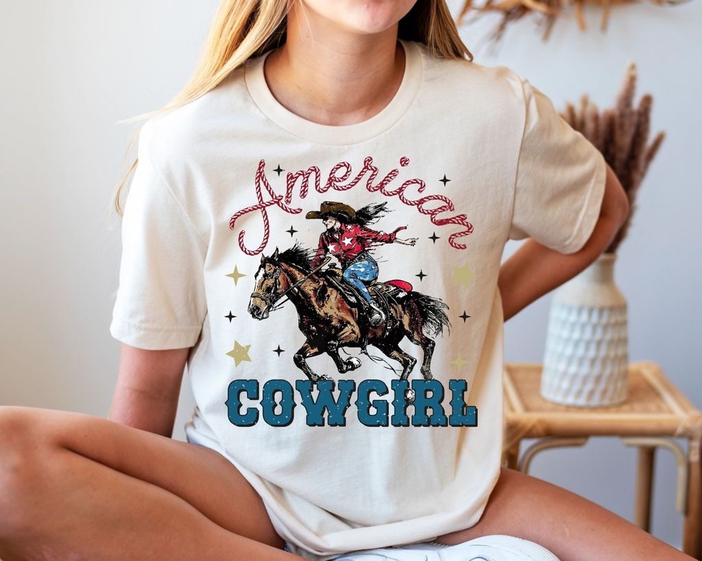 "American Cowgirl" DTF Transfer featuring a patriotic cowgirl and horse design for 4th of July shirts.