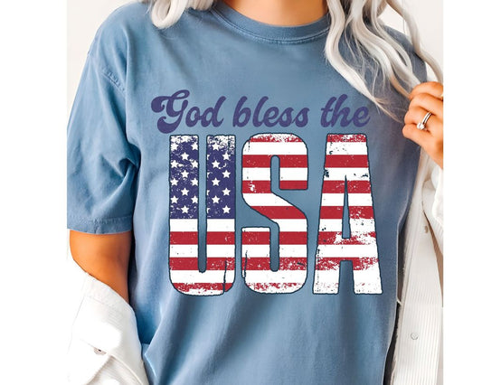 "God Bless the USA" 4th of July DTF Transfer featuring bold, distressed-textured USA letters filled with the American flag.