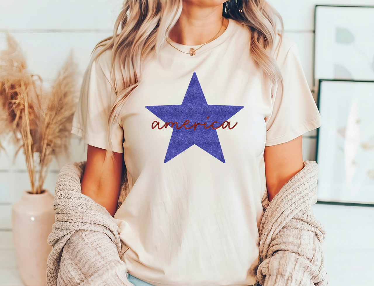 Beige t-shirt featuring a bold blue star with 'America' text design, ideal for 4th of July DTF transfers.