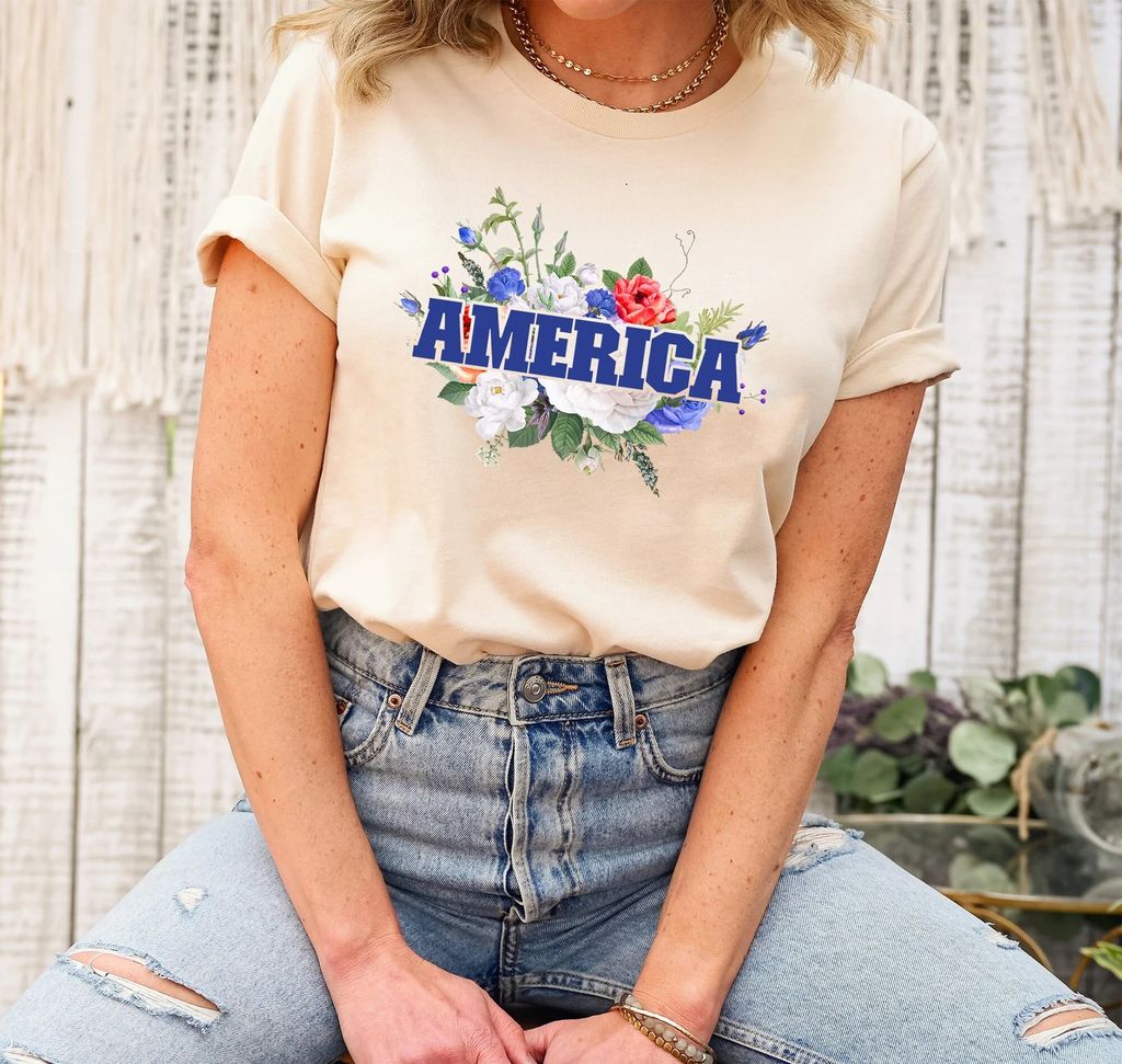 Floral America 4th of July Ready-to-Press DTF Transfer featuring red, white, and blue flowers on a neutral t-shirt.