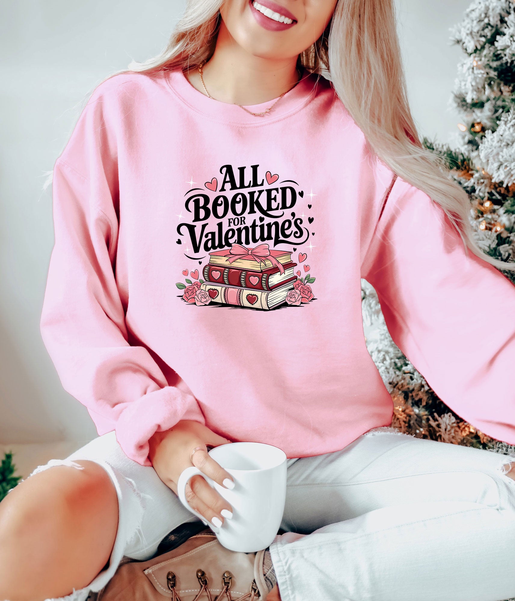 Pink sweatshirt with a Valentine's Day-themed book lover DTF transfer featuring books and hearts.