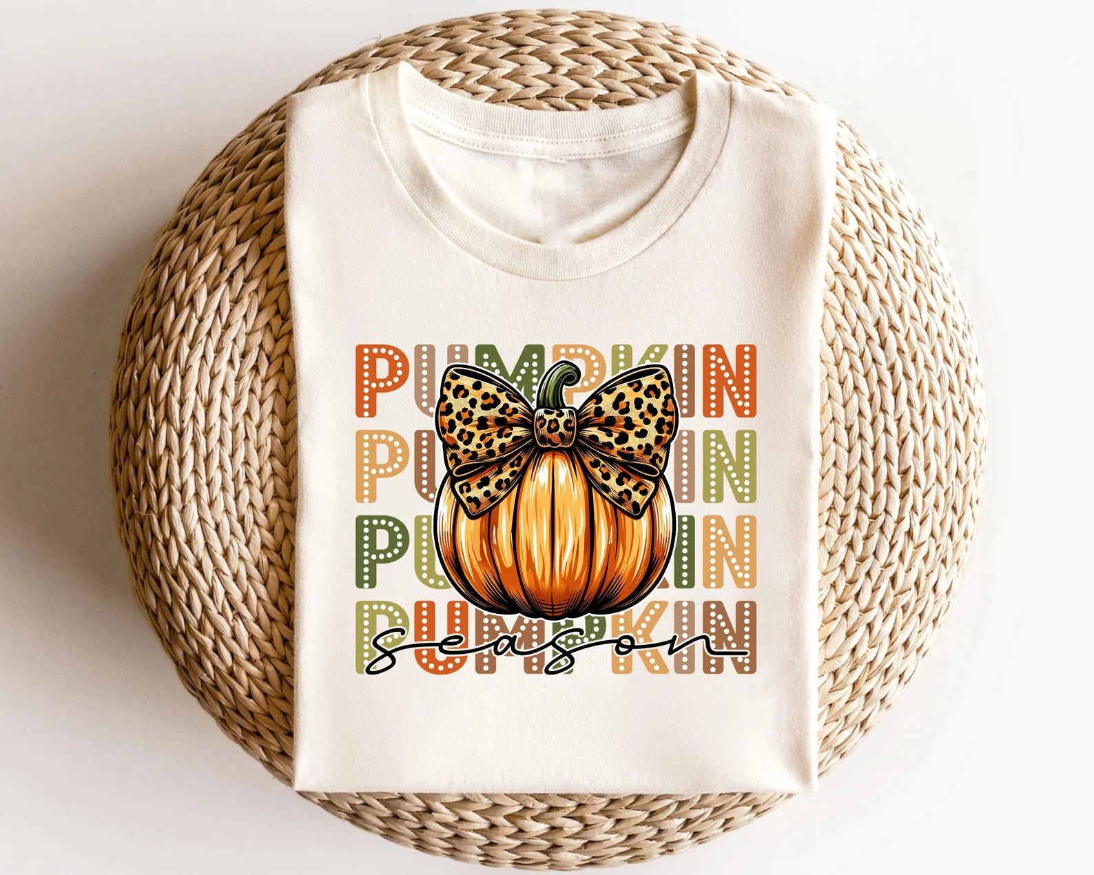 Pumpkin with leopard bow DTF transfer on a cream sweatshirt