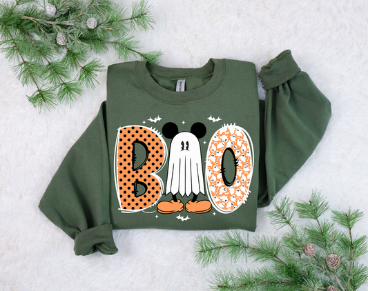 Halloween-themed ghost saying "Boo" DTF transfer on a green sweatshirt