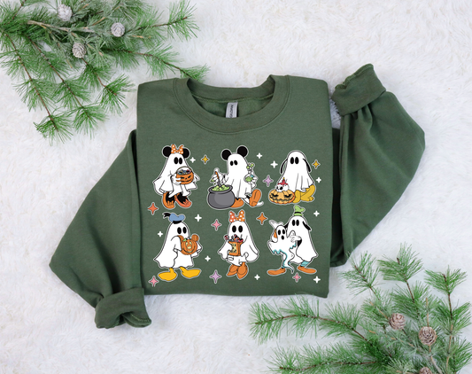 Group of cartoon ghosts celebrating Halloween on a green sweatshirt.