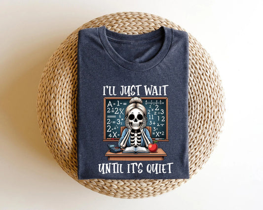 Humorous skeleton baking DTF transfer on a navy blue t-shirt.