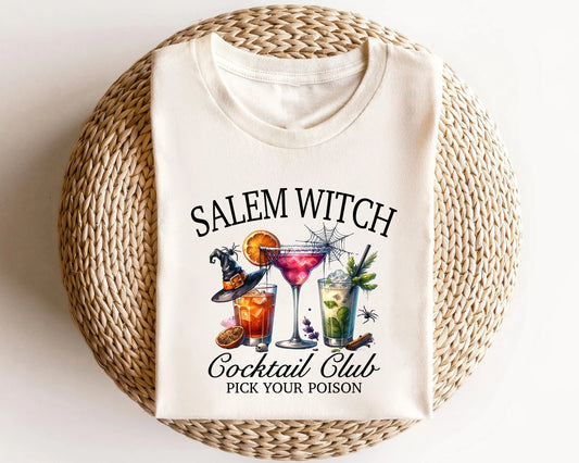 Witch-themed cocktail graphics on a white t-shirt.