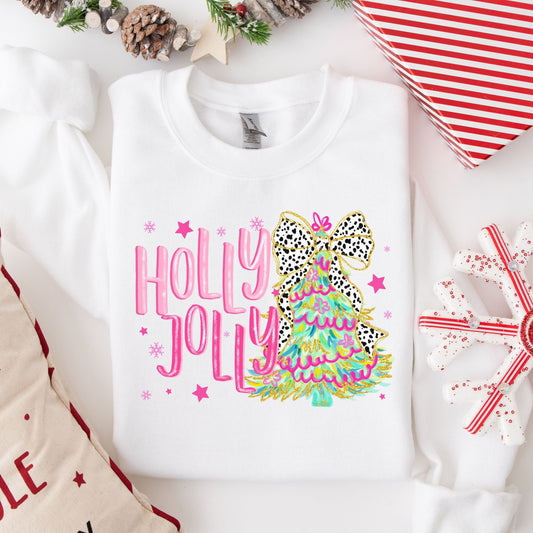 "Holly Jolly" Christmas tree DTF transfer on a white sweatshirt, highlighted by a leopard print bow and festive pink text.