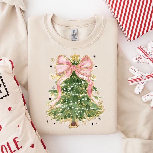 Elegant Christmas tree DTF transfer with a pink bow and gold details on a beige sweatshirt, ideal for holiday fashion.