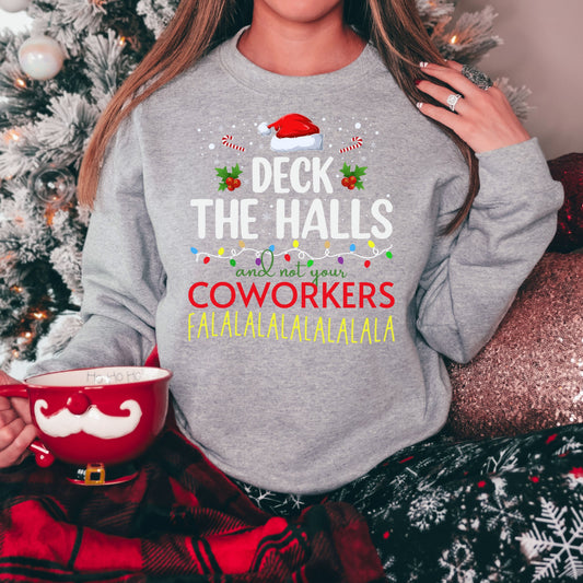 Humorous Christmas DTF transfer saying 'Deck the Halls and not your coworkers' on a gray sweater