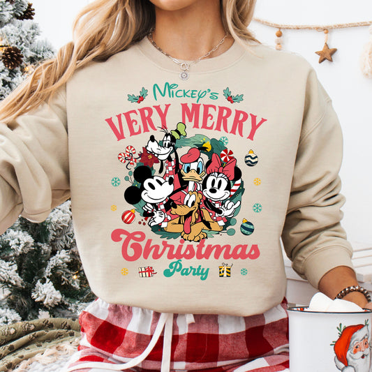 Mickey Mouse and friends celebrating at Mickey's Very Merry Christmas Party on a beige sweatshirt.