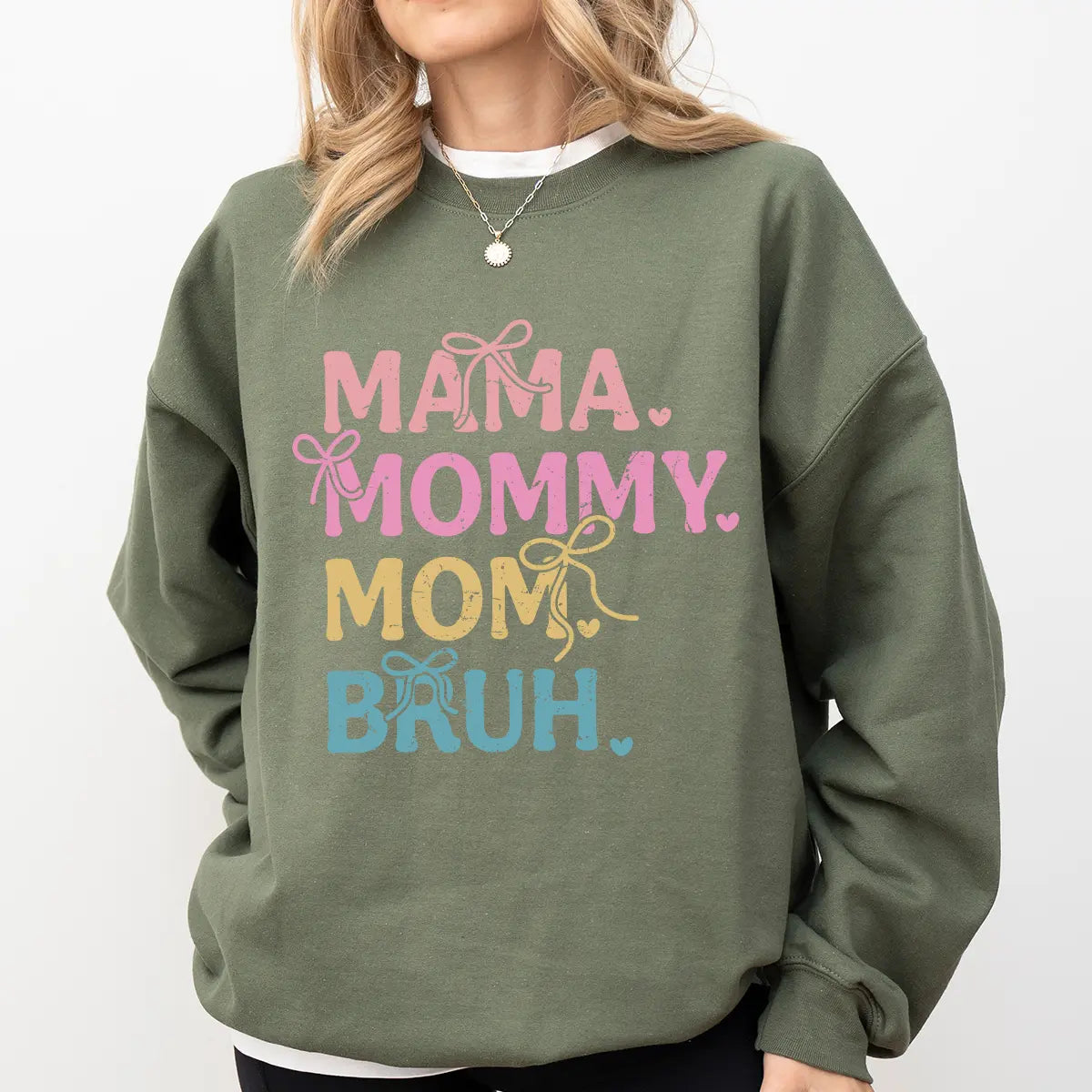 DTF Transfers ready to press – Mama Mommy Mom Bruh with pastel bows design on green sweatshirt for Mother's Day or custom mom shirts.