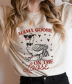 Woman wearing a cream shirt with the Mama Goose On The Loose graphic – a stylish goose with glasses and heels, featuring DTF Transfers ready to press.