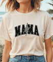 Woman in tan tee wearing bold varsity-style “MAMA” with checkered lightning bolt graphic – featuring DTF Transfers ready to press for custom t-shirt designs.