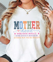Woman wearing retro rainbow block letter “Motherhood” shirt with uplifting quote – designed using DTF Transfers ready to press.