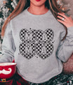 DTF Transfers ready to press – MAMA Checkerboard Hearts design on a gray sweatshirt featuring four black-and-white retro hearts with block letters.