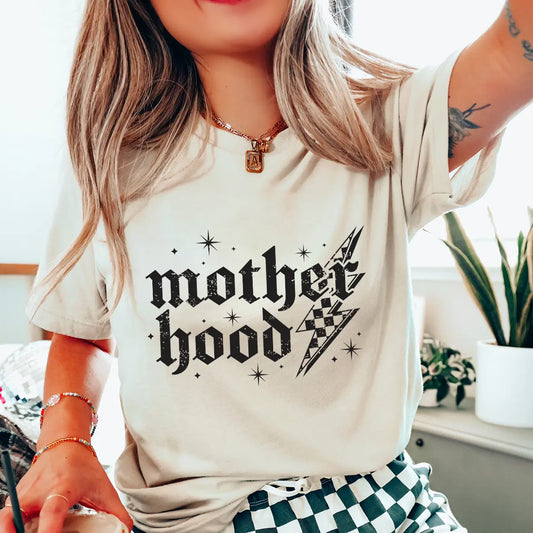 DTF Transfers ready to press – edgy gothic “Motherhood” lightning bolt design in distressed black on a cream t-shirt.