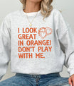 DTF Transfers ready to press – bold orange “I Look Great in Orange! Don’t Play with Me” design with heart-shaped handcuffs for t-shirts and sweatshirts.
