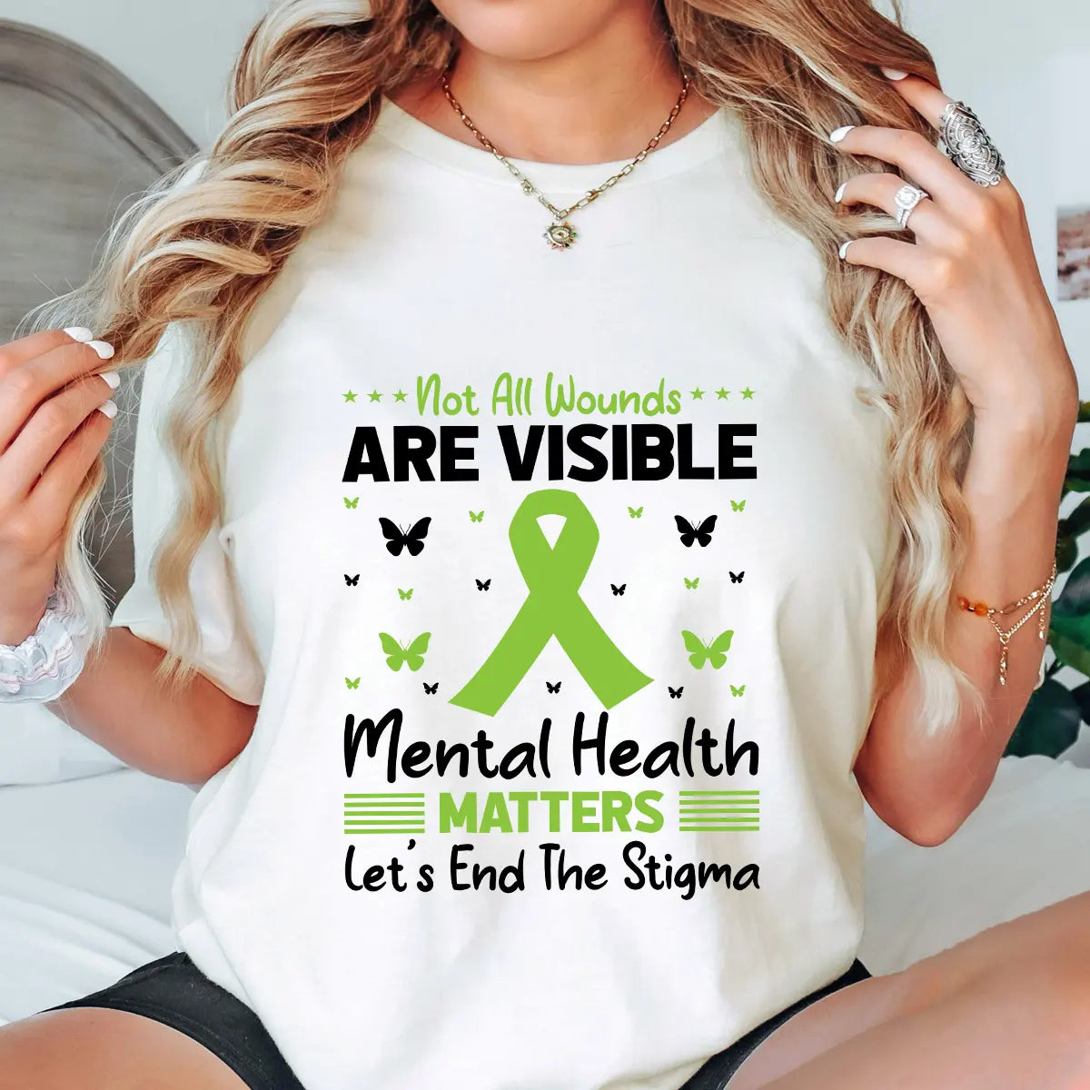 DTF Transfers ready to press – “Not All Wounds Are Visible” green ribbon mental health awareness design with butterflies, shown on a white tee for advocacy wear.