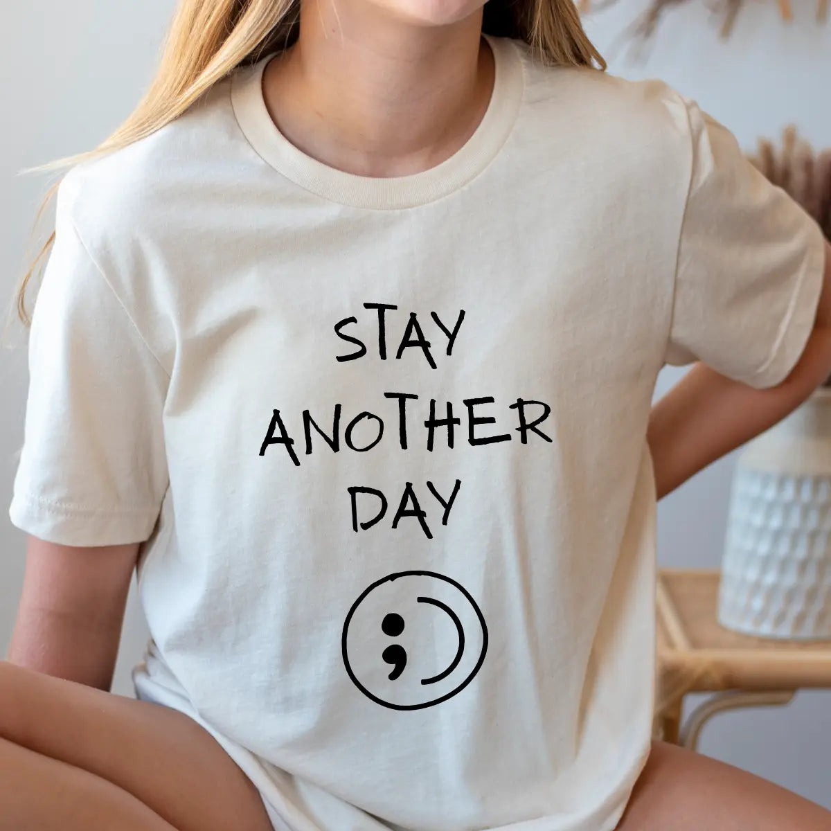 DTF Transfers ready to press – black handwritten “Stay Another Day” with semicolon symbol on neutral t-shirt, minimalist mental health awareness design.