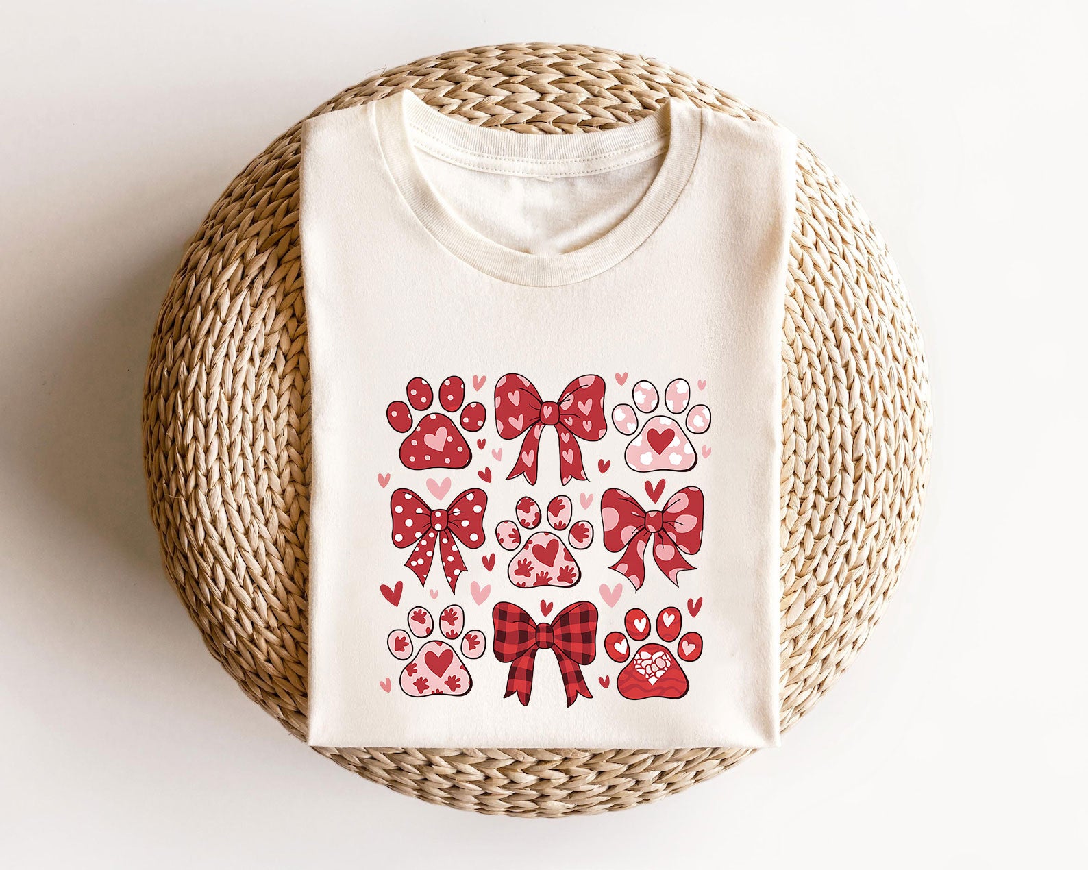 Paw prints and bows ready-to-press DTF transfer design in red and pink for custom T-shirts and hoodies.