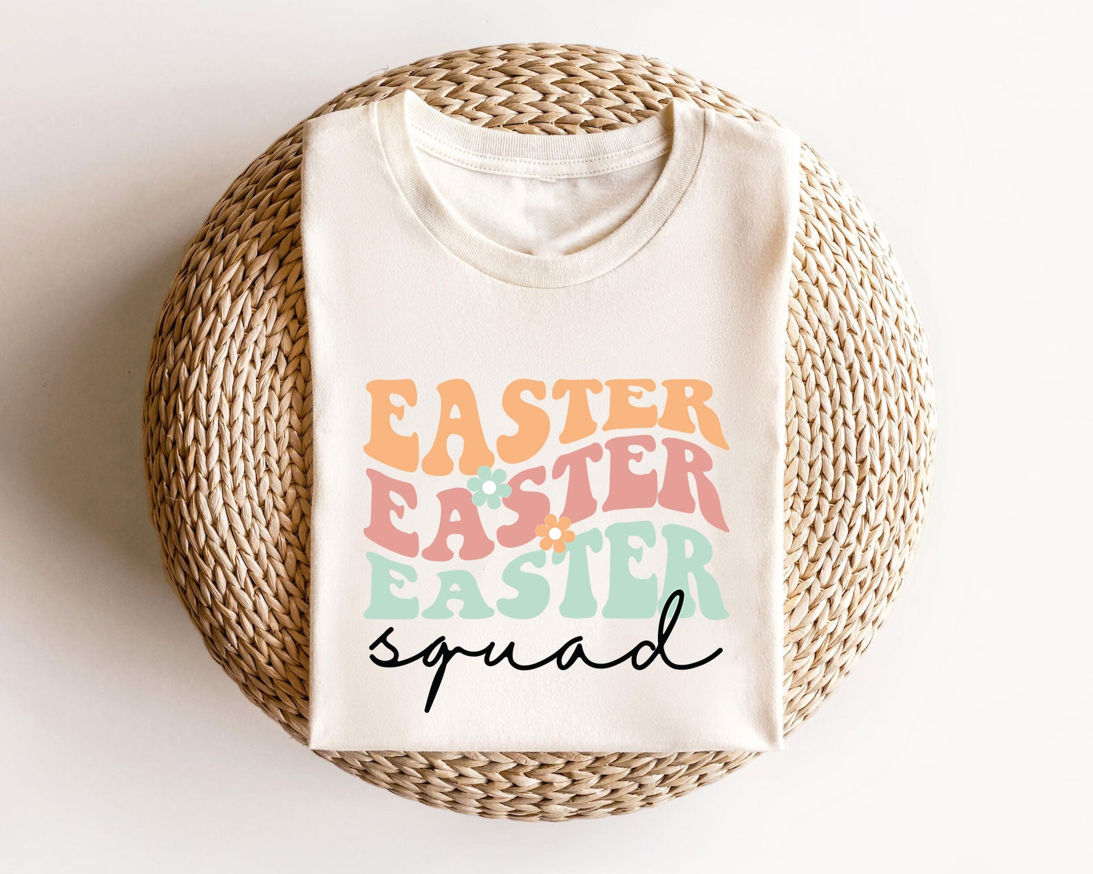 Cream t-shirt featuring a pastel retro-style Easter Squad text design, perfect for Easter family and group matching shirts.