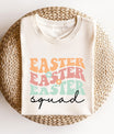 Cream t-shirt featuring a pastel retro-style Easter Squad text design, perfect for Easter family and group matching shirts.