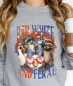 Gray sweatshirt with “Red White and Feral” DTF transfer featuring patriotic raccoons, ducks, and opossum in red, white, and blue celebration gear.