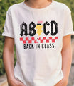 White T-shirt with ABCD Back in Class rock band style DTF transfer design.