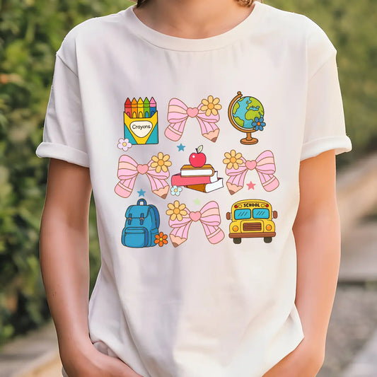 White T-shirt with pastel school-themed DTF transfer design featuring pink bows and school icons.