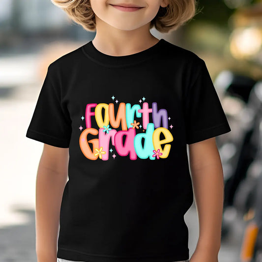 Black T-shirt with colorful “Fourth Grade” DTF transfer design featuring large bright bubble letters and flower accents.