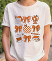 White T-shirt with orange and white school-themed DTF transfer featuring bows, apple, globe, pencil, and books.