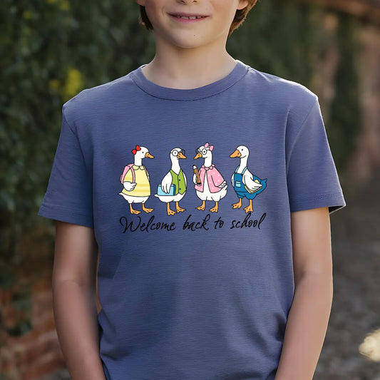 Navy-blue T-shirt with “Welcome back to school” DTF transfer design featuring four cute cartoon geese in school outfits with backpacks and books.