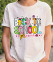 White T-shirt with “Back to School” DTF transfer design in large colorful patterned letters with florals, bow, lightning bolt, and pink checker border.