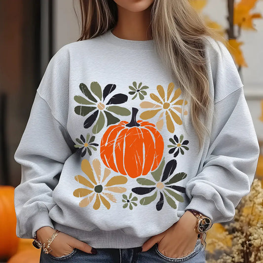Gray sweatshirt with “Rustic Pumpkin & Flowers” DTF transfer design featuring a large orange pumpkin surrounded by hand-painted fall flowers in muted tones.