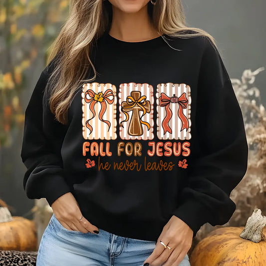 Black sweatshirt with “Fall for Jesus He Never Leaves” DTF transfer design featuring rustic cross, striped fall bows, and warm autumn colors.
