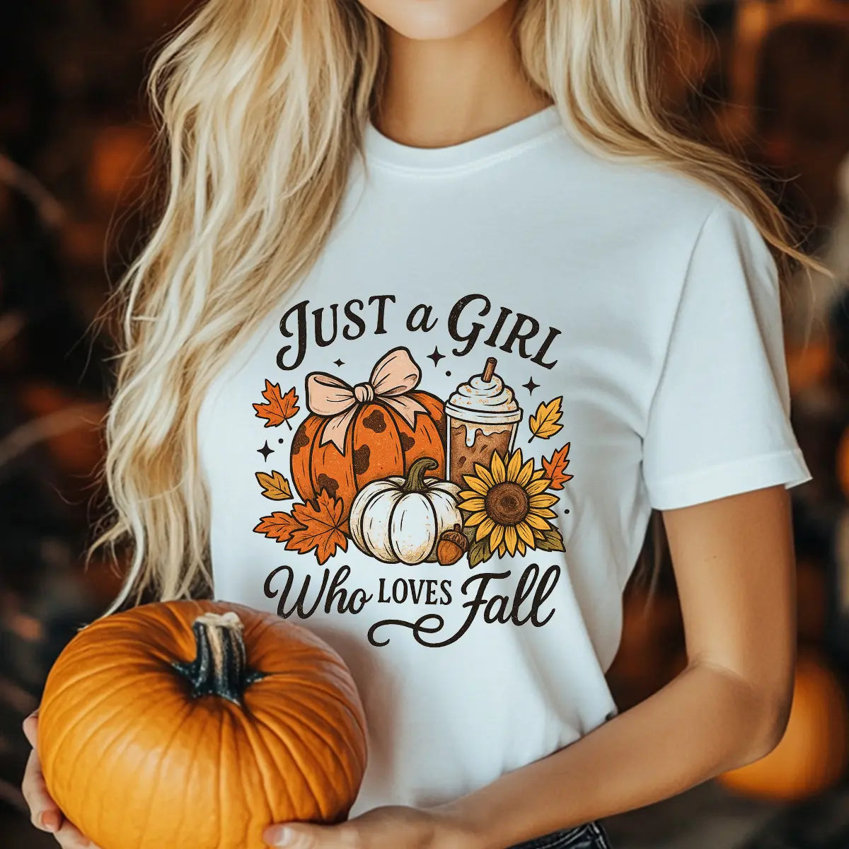 White T-shirt with “Just a Girl Who Loves Fall” DTF transfer design featuring pumpkins with a bow, sunflowers, fall leaves, and coffee.