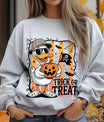 Gray sweatshirt with “Trick or Treat” DTF transfer design featuring a cool duck in sunglasses holding a Jack-o'-lantern, with bats and Halloween decorations.