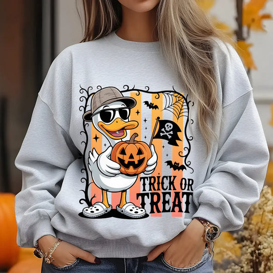 Gray sweatshirt with “Trick or Treat” DTF transfer design featuring a cool duck in sunglasses holding a Jack-o'-lantern, with bats and Halloween decorations.