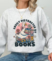 Ash grey sweatshirt with “Easily Distracted by Books” DTF transfer design featuring a cute goose, books, and floral accents—ideal for readers.